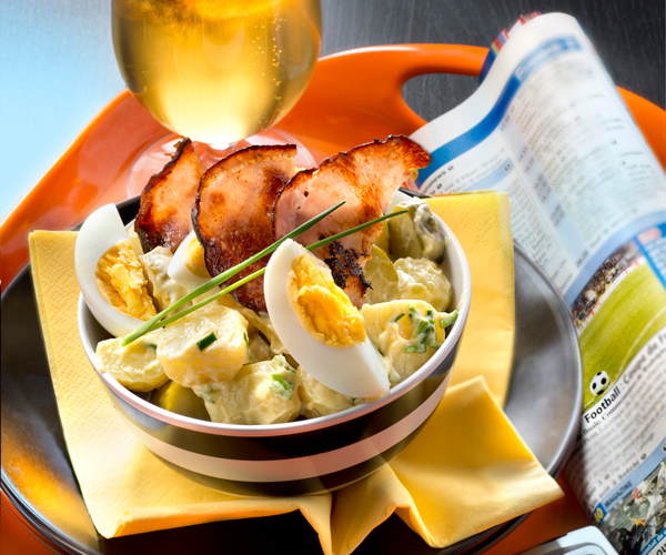 Easy recipe potato salad with gherkins, boiled eggs and bacon